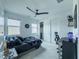 Cozy bedroom with a full size bed, modern ceiling fan, closet, and dedicated desk area at 270 Shaded Canyon Dr, Henderson, NV 89012