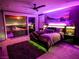 Modern bedroom featuring ambient lighting, a private balcony, and stunning city views at 270 Shaded Canyon Dr, Henderson, NV 89012
