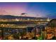 Panoramic city views at night, showcasing the vibrant Las Vegas skyline and surrounding mountains at 270 Shaded Canyon Dr, Henderson, NV 89012