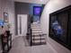 Modern entryway featuring tile floors, staircase, stylish decor, and a security gate at 270 Shaded Canyon Dr, Henderson, NV 89012