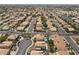 Expansive aerial view showcases a meticulously planned residential community with swimming pools and mature trees at 2716 Timber Crossing Ct, Henderson, NV 89074