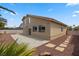 The backyard features a patio area in the desert landscape at 2716 Timber Crossing Ct, Henderson, NV 89074