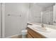 Bright, clean bathroom featuring a shower and wood-look vanity at 2716 Timber Crossing Ct, Henderson, NV 89074