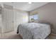 This comfortable bedroom features a ceiling fan and closet with bi-fold doors at 2716 Timber Crossing Ct, Henderson, NV 89074