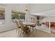 Sunlit dining area adjacent to the kitchen with wood table and chairs at 2716 Timber Crossing Ct, Henderson, NV 89074