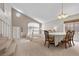 The dining room offers plenty of natural light and flows to the living room at 2716 Timber Crossing Ct, Henderson, NV 89074