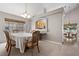 Bright dining room with a glimpse into the kitchen and a neighboring breakfast nook at 2716 Timber Crossing Ct, Henderson, NV 89074