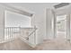 The second floor hallway leads to the bedrooms and overlooks the living room at 2716 Timber Crossing Ct, Henderson, NV 89074
