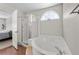 This is a view of the ensuite main bathroom with a standalone tub and shower at 2716 Timber Crossing Ct, Henderson, NV 89074