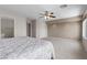 Spacious main bedroom with carpeted floors, ceiling fan, and multiple closets at 2716 Timber Crossing Ct, Henderson, NV 89074