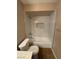 This bathroom includes a new tub and shower with stylish white marble accents at 2750 S Durango Dr # 1080, Las Vegas, NV 89117