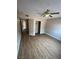 Bedroom featuring a ceiling fan, closet and wood-look flooring at 2750 S Durango Dr # 1080, Las Vegas, NV 89117