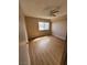 Bedroom with wood-look flooring and natural light from a window at 2750 S Durango Dr # 1080, Las Vegas, NV 89117