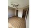 This bedroom includes wood laminate flooring, closet and ceiling fan at 2750 S Durango Dr # 1080, Las Vegas, NV 89117