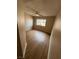 Bedroom with wood-look flooring, ceiling fan and natural light from a window at 2750 S Durango Dr # 1080, Las Vegas, NV 89117