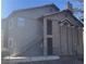 Two-story condo building featuring a stucco exterior and a staircase leading to the upper units at 2750 S Durango Dr # 1080, Las Vegas, NV 89117