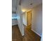 Hallway featuring durable wood-look flooring and neutral wall paint at 2750 S Durango Dr # 1080, Las Vegas, NV 89117