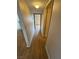 Hallway with wood-look floors leading to rooms, illuminated by a ceiling light at 2750 S Durango Dr # 1080, Las Vegas, NV 89117