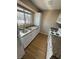 Efficient kitchen featuring white cabinetry and granite countertops with natural light from the window at 2750 S Durango Dr # 1080, Las Vegas, NV 89117