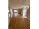 Open living space with wood-look floors that connects to a balcony with natural light at 2750 S Durango Dr # 1080, Las Vegas, NV 89117