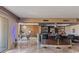 Open bar area with stools, counterspace, mirrored shelving and views of dining area at 2777 Paradise Rd # 1801, Las Vegas, NV 89109