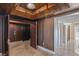 Elegant hallway with wood paneling, marble floors, and access to elevator and other rooms at 2777 Paradise Rd # 1801, Las Vegas, NV 89109