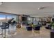 Bright, spacious living room featuring a grand piano, bar, and mountain views at 2777 Paradise Rd # 1801, Las Vegas, NV 89109