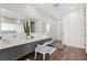 Luxurious bathroom with double vanity, large mirror, and glass-enclosed shower at 2787 La Bella Ct, Henderson, NV 89052