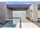 Modern home featuring a sleek water feature and minimalist desert landscape at 2787 La Bella Ct, Henderson, NV 89052