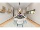 Elegant dining room with modern decor, stylish lighting, and seating for eight, creating an inviting space at 2787 La Bella Ct, Henderson, NV 89052