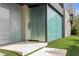 Modern home showcasing a grand glass entrance and minimalist landscaping at 2787 La Bella Ct, Henderson, NV 89052