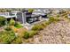 Hillside modern home featuring a large pool, putting green, and desert landscaping at 2787 La Bella Ct, Henderson, NV 89052