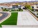 Beautiful modern house with a circular driveway and well-manicured landscaping at 2787 La Bella Ct, Henderson, NV 89052
