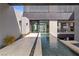 Modern home exterior with walkway, water feature, and sleek architectural details at 2787 La Bella Ct, Henderson, NV 89052