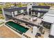 Stunning aerial view of modern home showcasing rooftop deck, pool, and sleek architectural design at 2787 La Bella Ct, Henderson, NV 89052