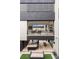 Stunning home exterior with a balcony overlooking an outdoor kitchen and lounge area, blending indoor/outdoor living at 2787 La Bella Ct, Henderson, NV 89052