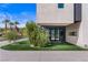 Modern home featuring a well-manicured lawn and contemporary architectural details at 2787 La Bella Ct, Henderson, NV 89052