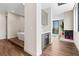 Hallway featuring sleek bar, access to fireplace, modern design, and natural light at 2787 La Bella Ct, Henderson, NV 89052
