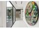 Hallway featuring white tile floor and large art piece to the right at 2787 La Bella Ct, Henderson, NV 89052