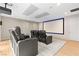 Luxurious home theater with plush seating, large screen, and ambient lighting for an immersive movie experience at 2787 La Bella Ct, Henderson, NV 89052