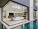 Open-concept living room seamlessly connects to the pool area with an telescope at 2787 La Bella Ct, Henderson, NV 89052