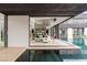 Bright living room connects to the pool with floor-to-ceiling windows at 2787 La Bella Ct, Henderson, NV 89052