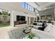 Open-concept living space with modern furniture, fireplace, and access to outdoor views at 2787 La Bella Ct, Henderson, NV 89052