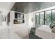 Bright and open main bedroom with fireplace, TV, and light colored floors at 2787 La Bella Ct, Henderson, NV 89052