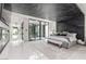 This expansive main bedroom has white tile floors, dark marble accent wall and ceiling, and a modern fireplace at 2787 La Bella Ct, Henderson, NV 89052