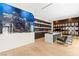 Home office featuring a large aquarium, custom shelving, and modern desk setup at 2787 La Bella Ct, Henderson, NV 89052