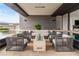Inviting outdoor area with comfortable seating, a fire pit, and access to the pool at 2787 La Bella Ct, Henderson, NV 89052