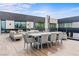 Spacious outdoor terrace featuring comfortable lounge furniture, dining, and outdoor sun umbrellas at 2787 La Bella Ct, Henderson, NV 89052