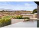 Infinity pool with views of the golf course and mountains in the distance at 2787 La Bella Ct, Henderson, NV 89052