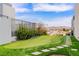 Residential putting green bordered by synthetic lawns adds recreation and enhances outdoor living space at 2787 La Bella Ct, Henderson, NV 89052